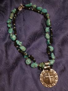 Black and Turquoise colored double strand with cross concho